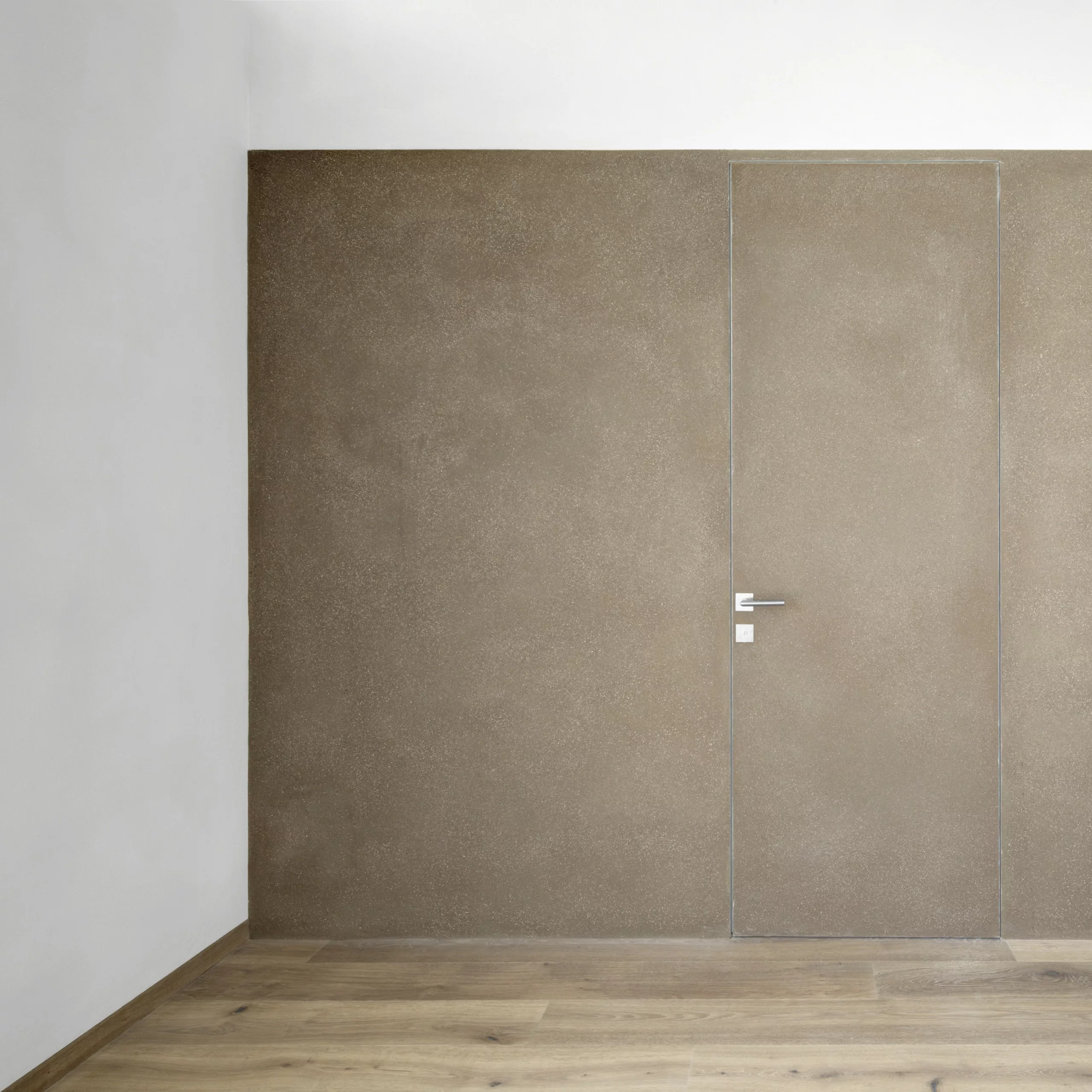 Matteo Brioni's coarse-grained clay plaster MultiTerra Smooth Cacao and Panna colors installed on walls, ceilings and furnitures in a private house in Brunico by Pedevilla Architects MultiTerra Smooth - Image 1